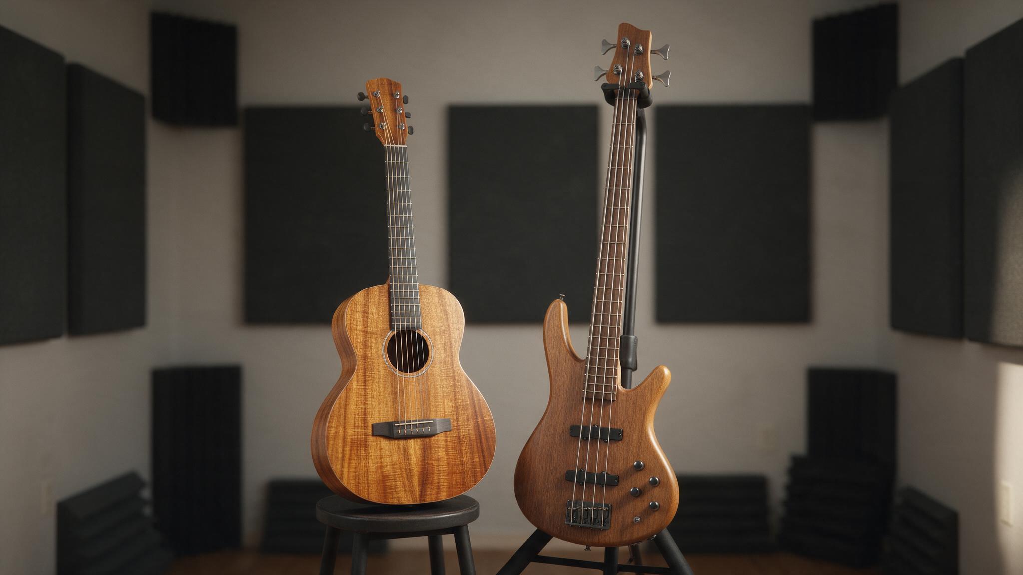 Petite guitare acoustique en koa et basse électrique dans une salle de répétition insonorisée